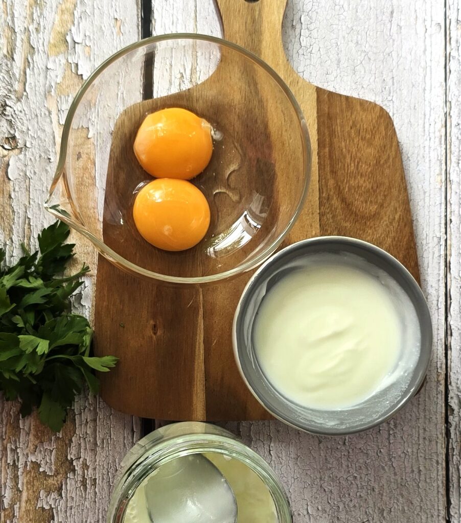 egg yolks, and Greek yoghurt ready to prepare thickening sauce