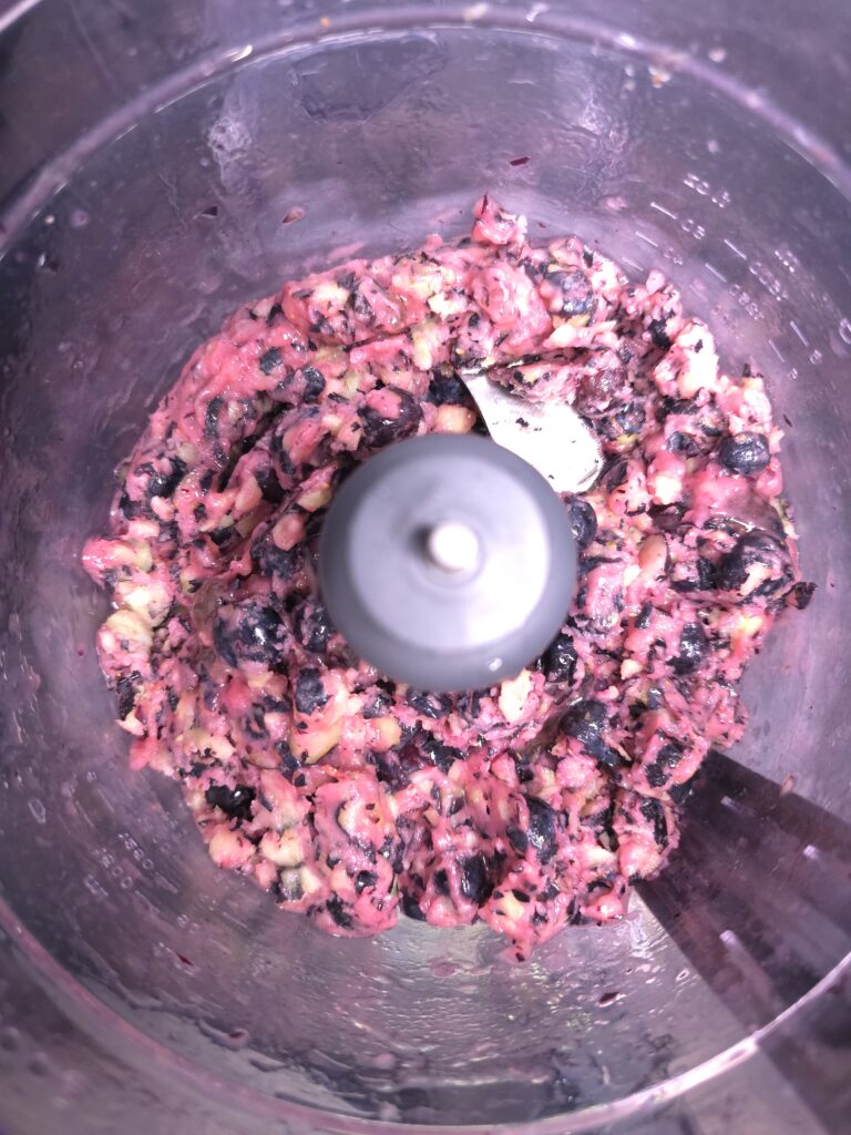 Blueberries, lemon and sweetener pulsed several times on a food processor