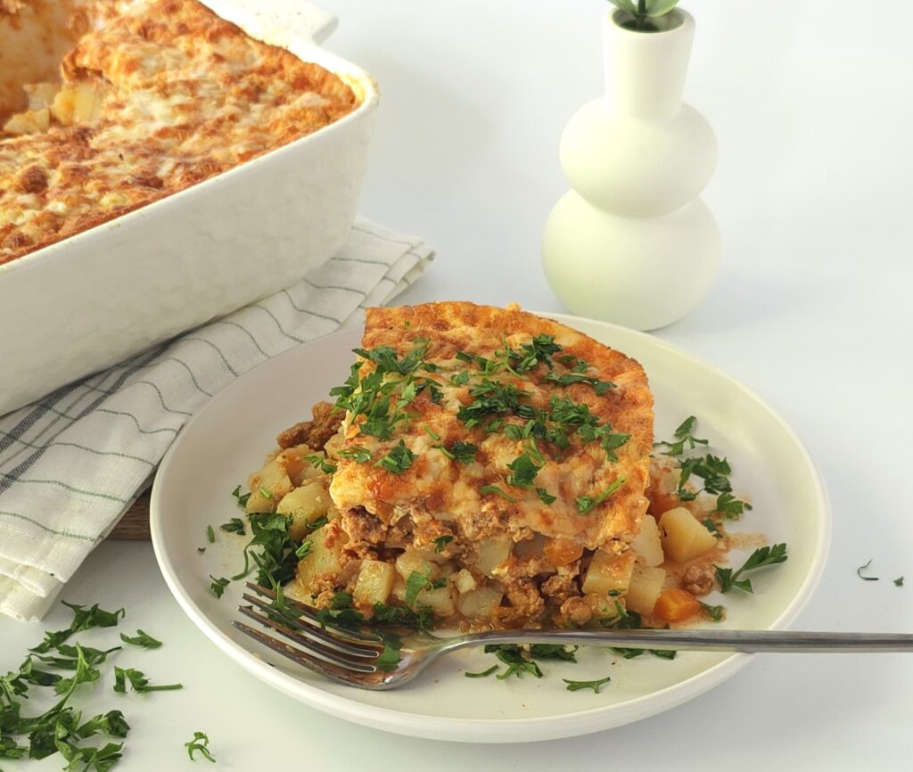 a white plate with a Bulgarian moussaka
