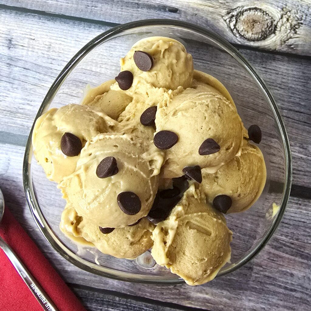 a glass bowl with homemade peanut-butter banana ice cream