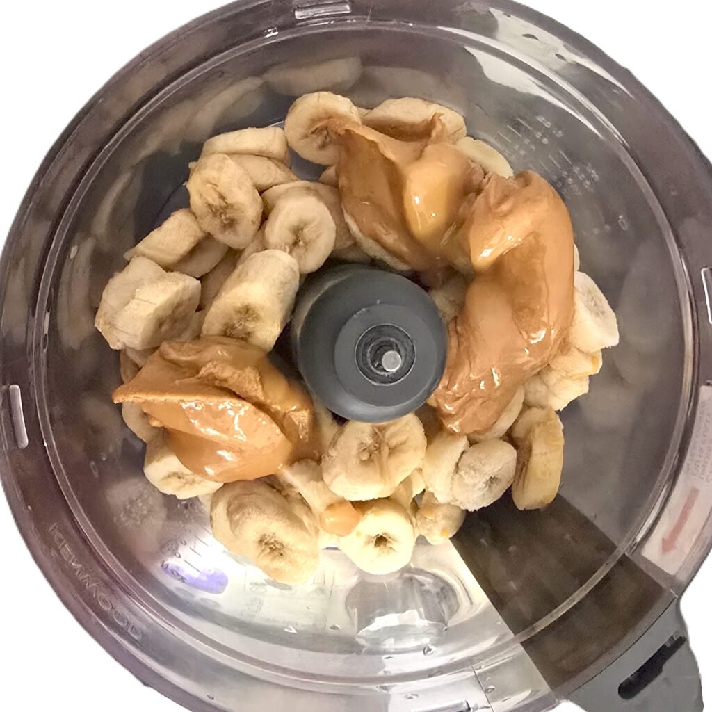 frozen banana slices and peanut butter in a food processor